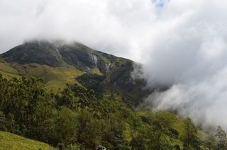 Kerala tour packages featuring Kochi to Munnar road trip through waterfalls and tea estates