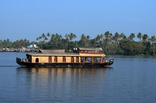 Alleppey houseboat experience included in premium Kerala tour packages