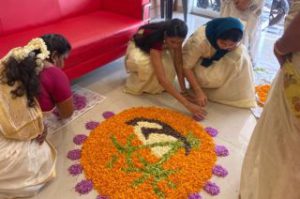 Colorful Pookalam made with fresh flowers during Onam Festival in Kerala