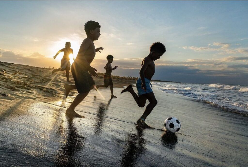 Children enjoying safe beach holiday with Kerala tour packages